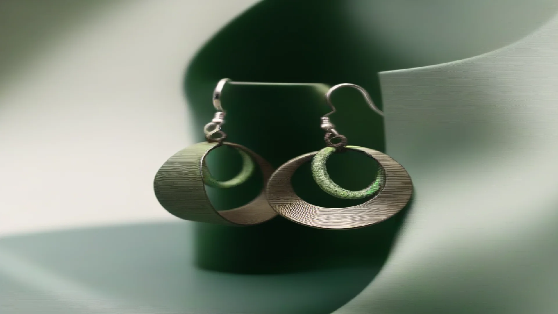 aijewelry loop earrings with army green background wide